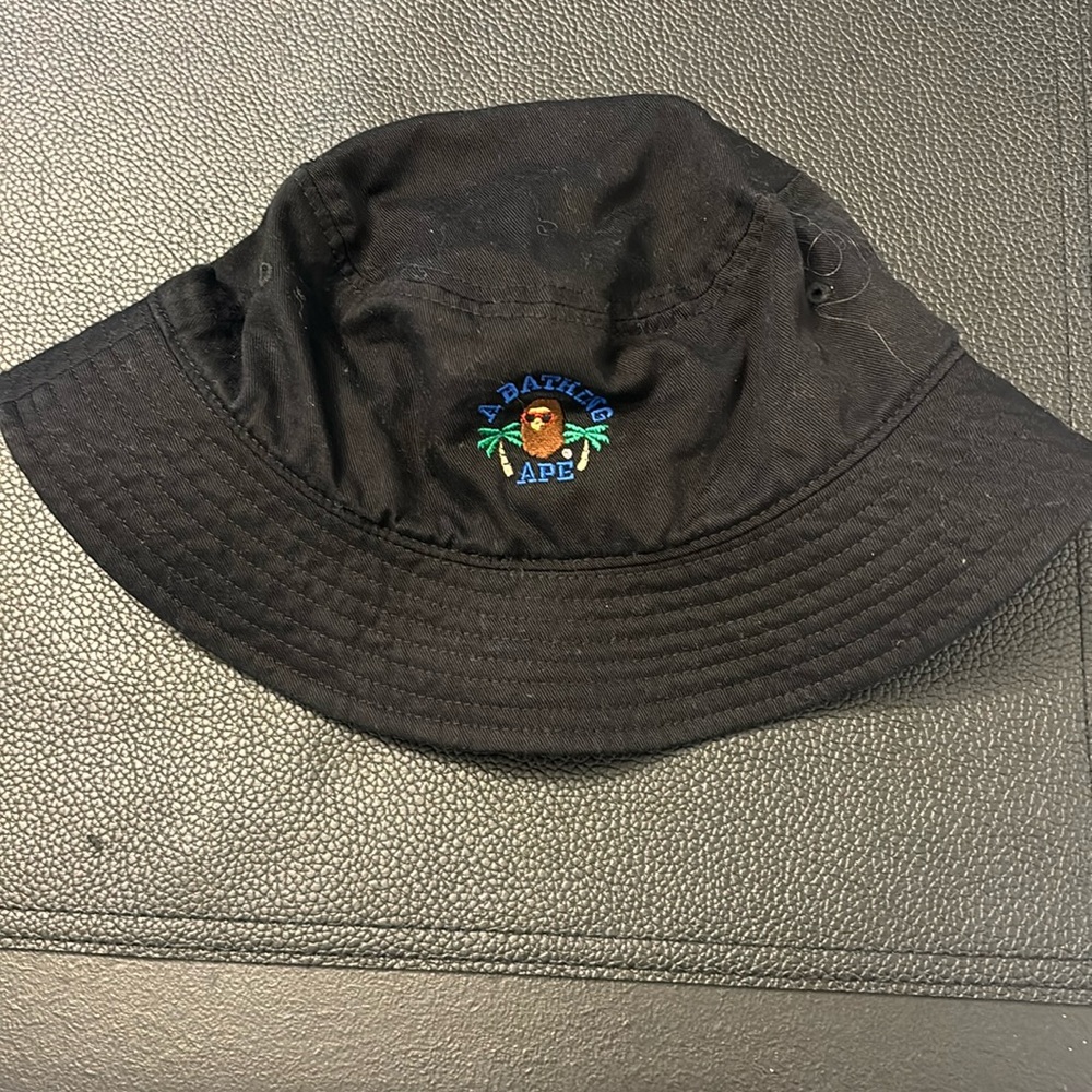 A Bathing Ape (Bape) black bucket hat with logo. Kids size or small adult head